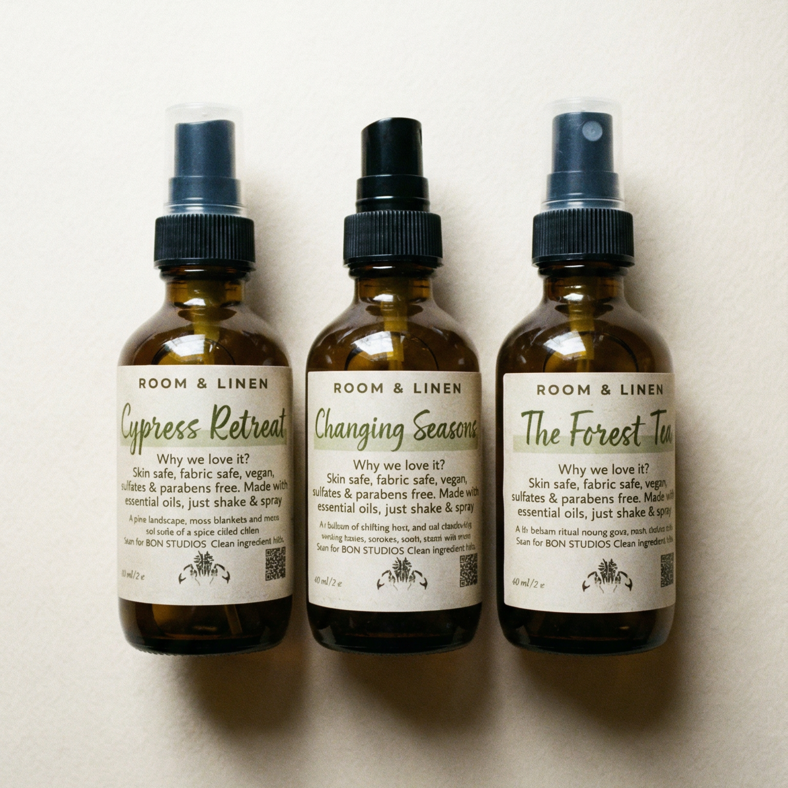 Three bottles of Room & Linen clean fragrance air sprays in various available scents.