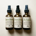 Three bottles of Room & Linen clean fragrance air sprays in various available scents.